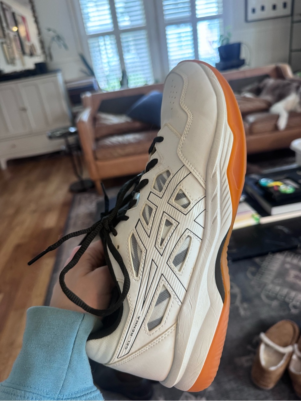 Asics White Athletic Shoe with Orange Outsole and Black Accents
